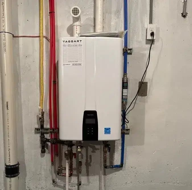 Taggart tankless water heater wall-mounted with PEX supply lines in Pittsburgh, PA