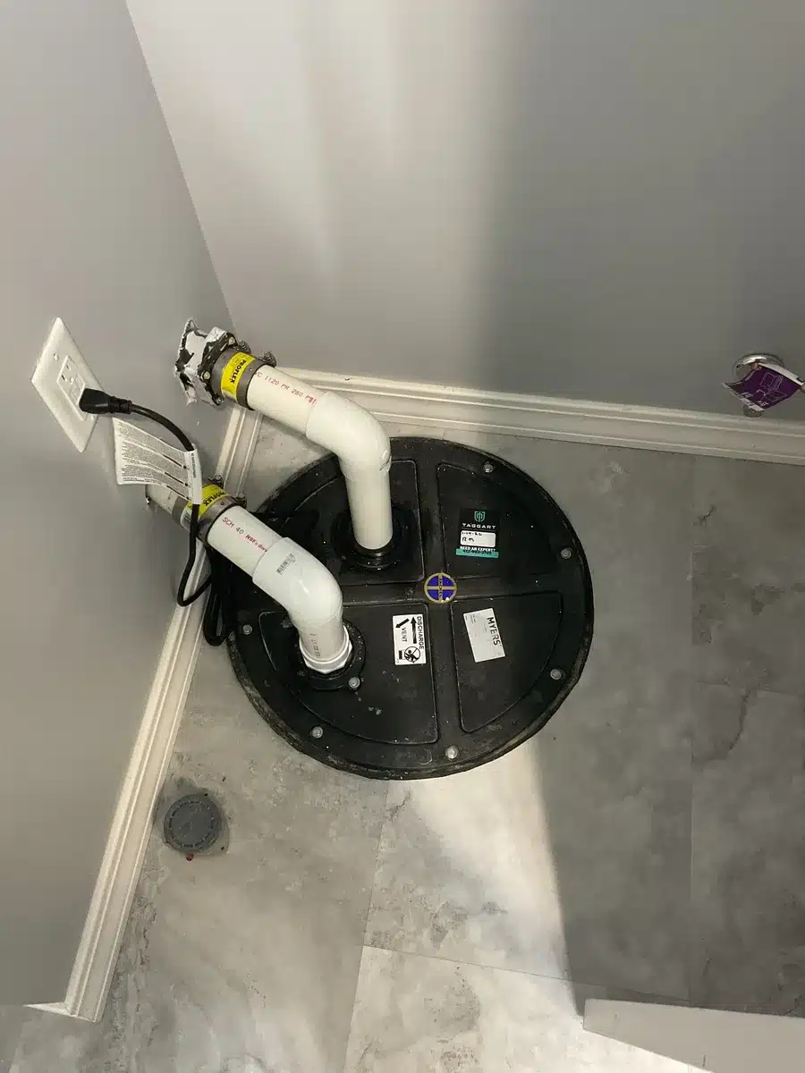 Sump pump discharge line and basement drainage plumbing in Pittsburgh, PA