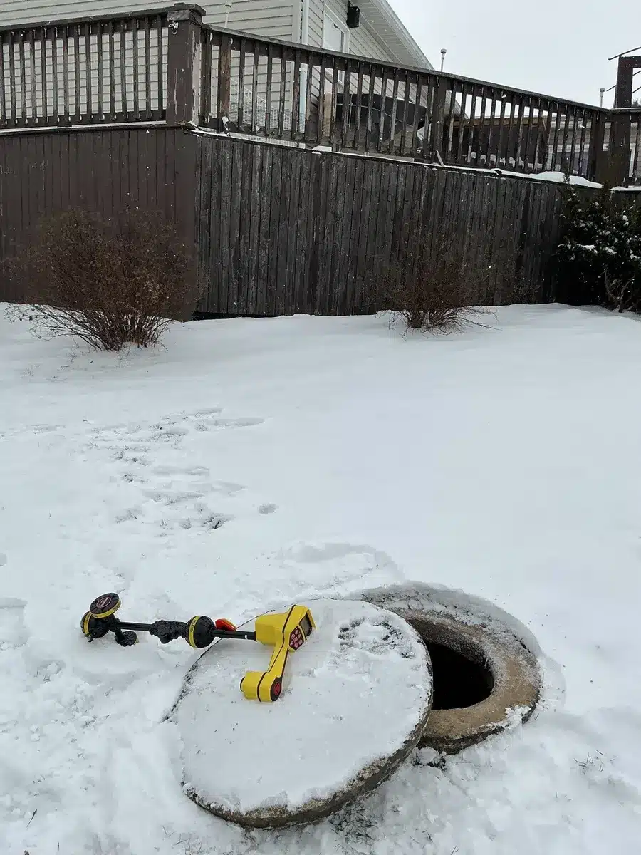 Outdoor sewer line cleanout access in snow for drain service in Pittsburgh, PA