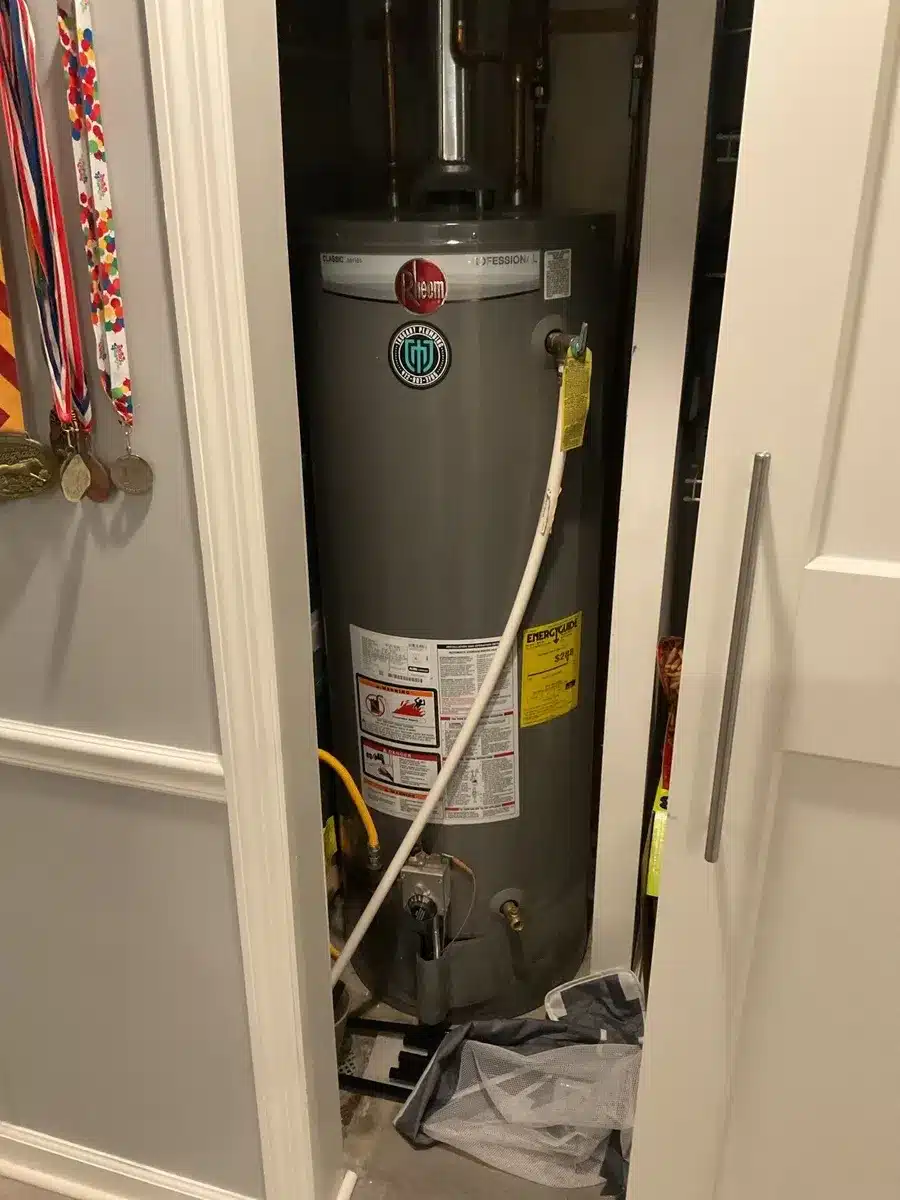 Rheem gas water heater installed in a utility closet in Pittsburgh, PA