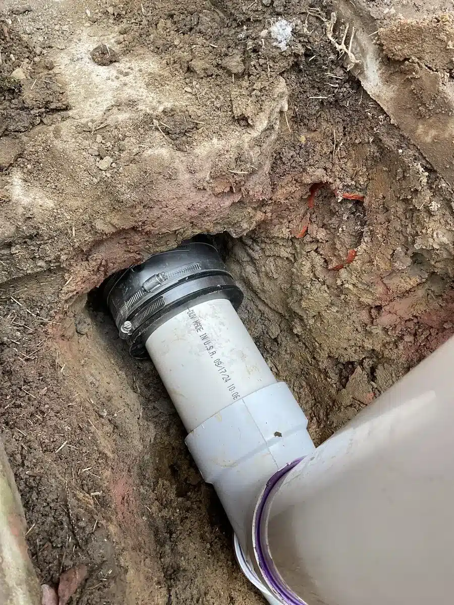 Underground sewer pipe repair during excavation in Pittsburgh, PA