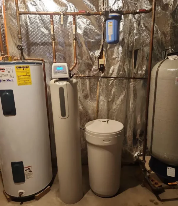 Novo whole-home water softener beside water heaters in a Pittsburgh, PA basement