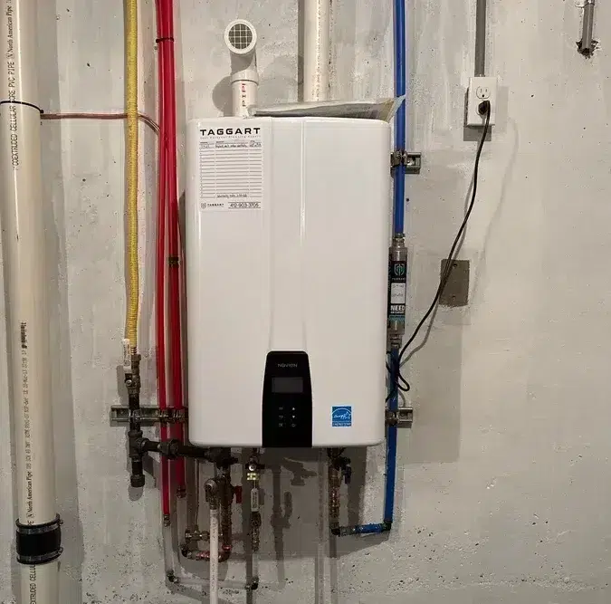 Taggart tankless water heater wall-mounted with PEX supply lines in Pittsburgh, PA