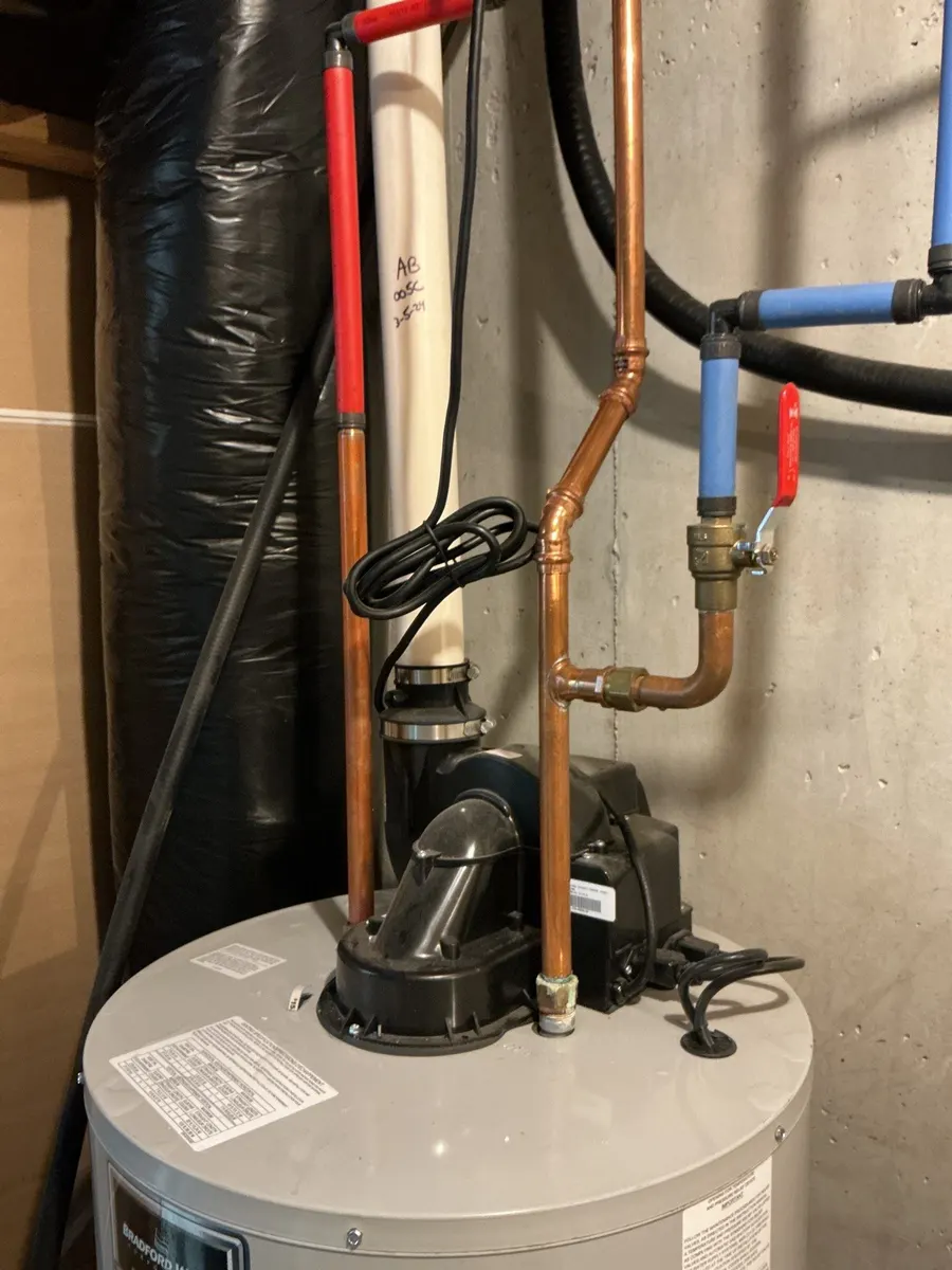 Copper and PEX lines connected at a water heater in Pittsburgh, PA