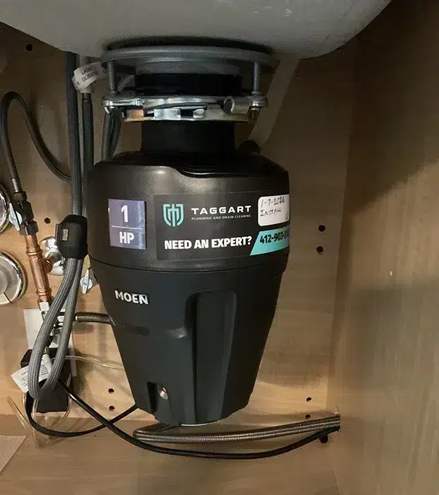 Garbage disposal installed under a kitchen sink in Pittsburgh, PA
