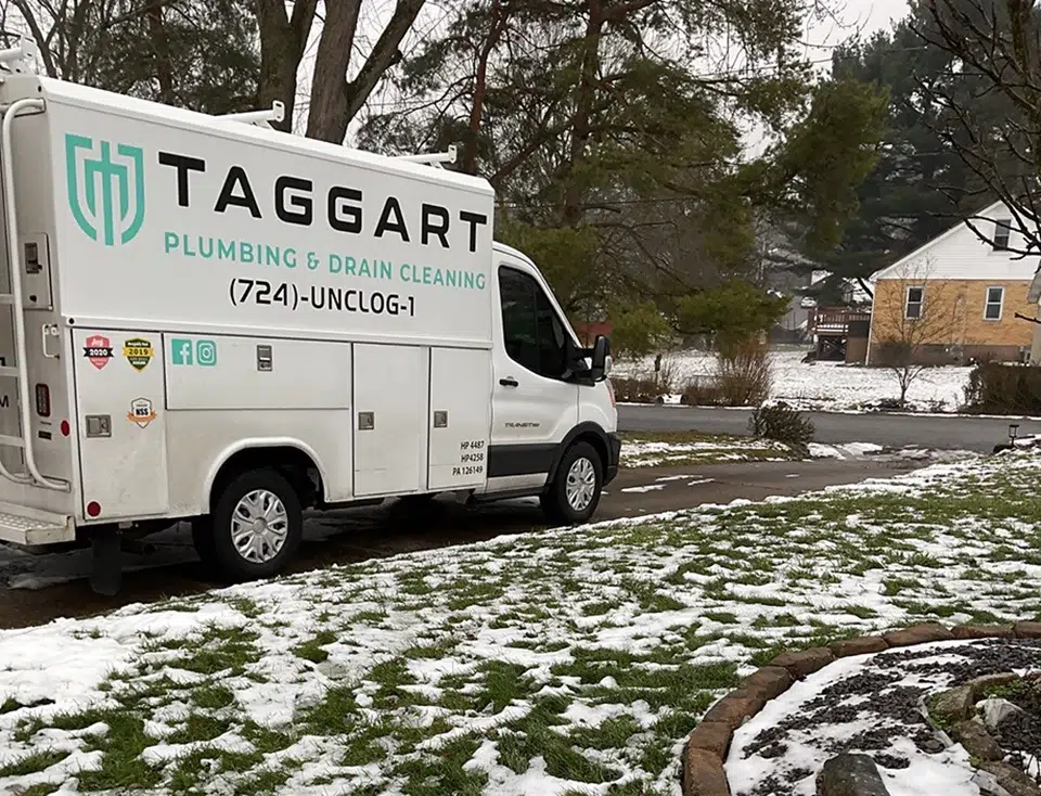 Taggart Plumbing service van parked at residential home in Pittsburgh, PA