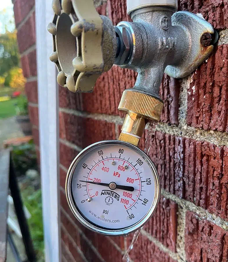 Water pressure test gauge on an outdoor hose spigot in Pittsburgh, PA