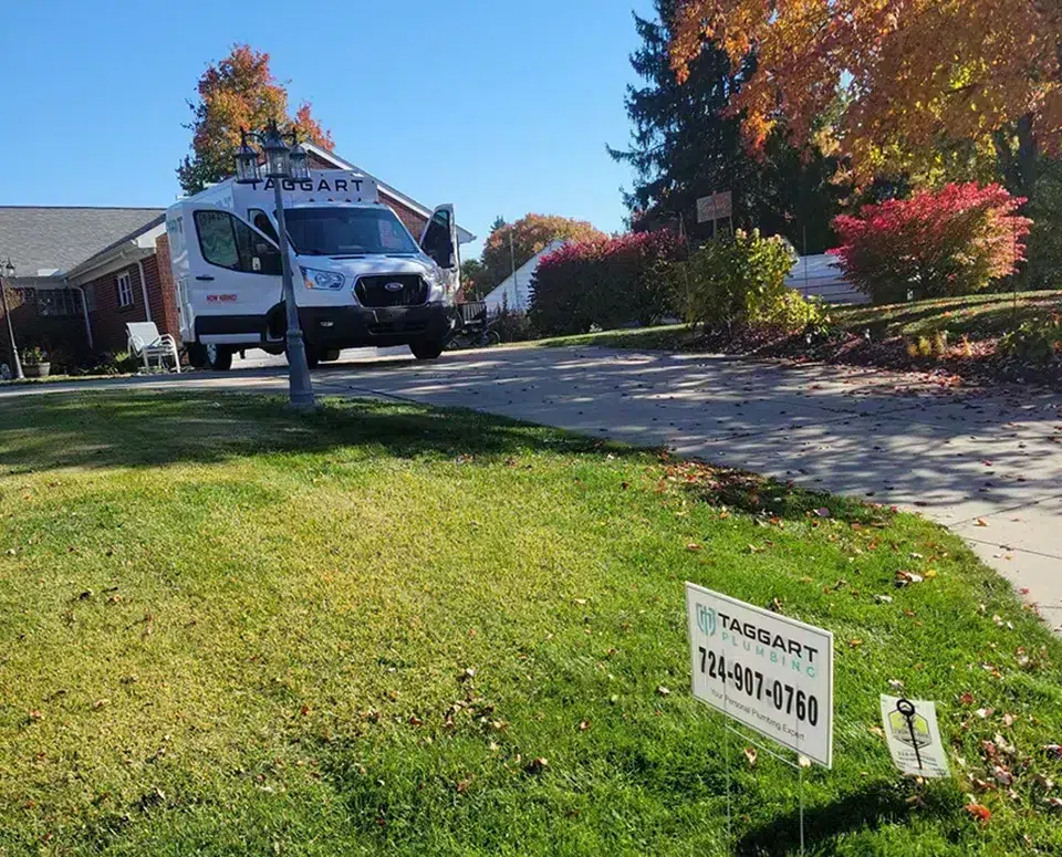 Taggart Plumbing yard sign at home in Pittsburgh, PA neighborhood