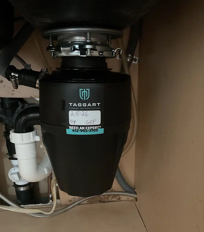 New Taggart garbage disposal installed under a sink in Pittsburgh, PA