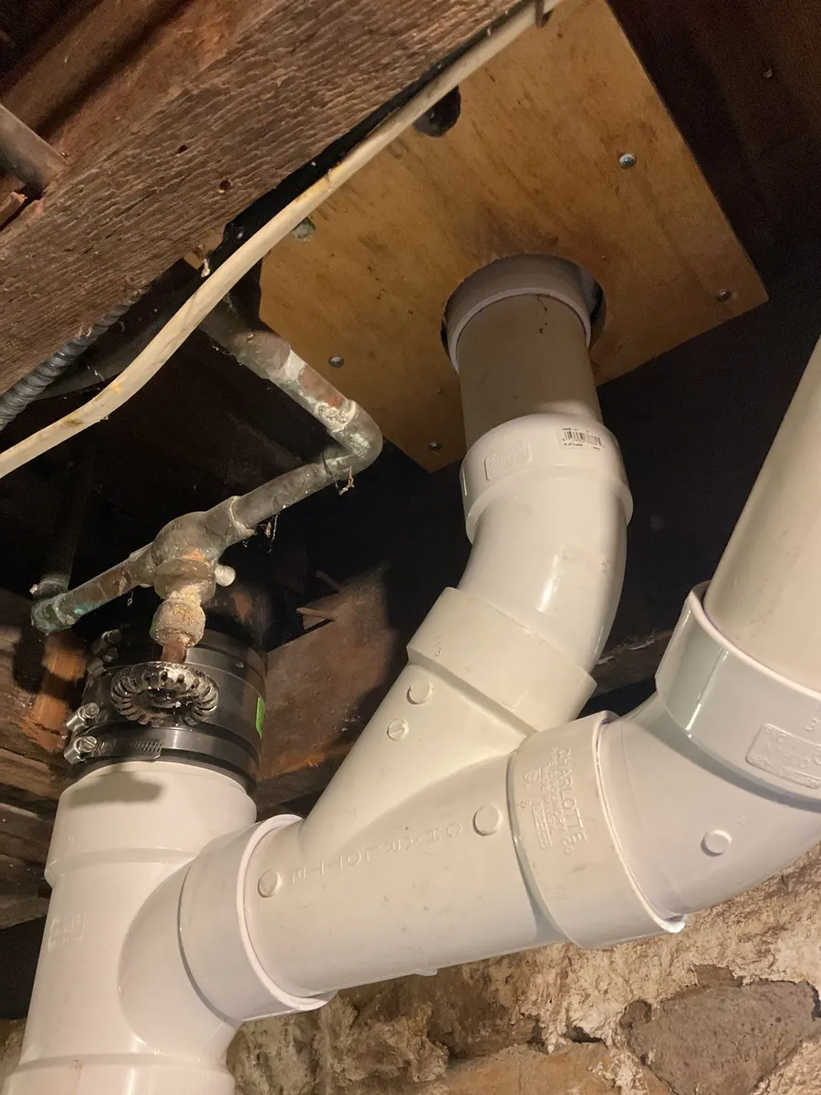 New PVC drain line installation in a Pittsburgh, PA basement