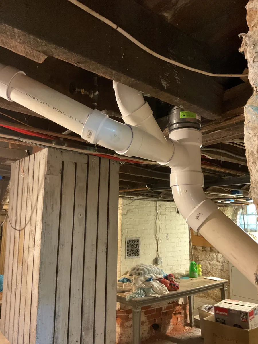 PVC drain and vent piping in a Pittsburgh, PA basement