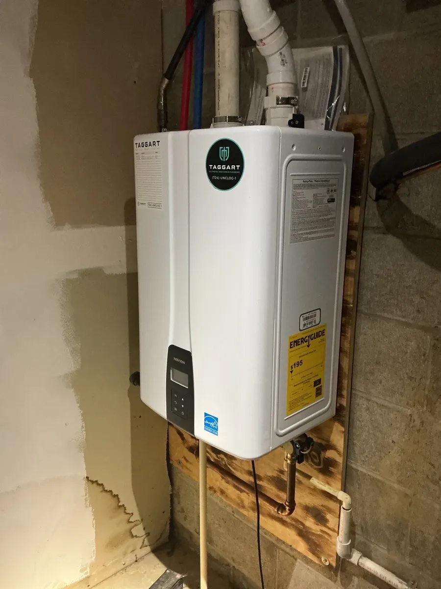Tankless water heater installed on a basement wall in Pittsburgh, PA