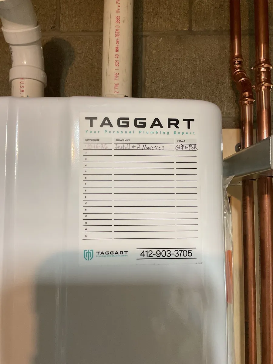 Tankless water heater with Taggart service sticker in Pittsburgh, PA