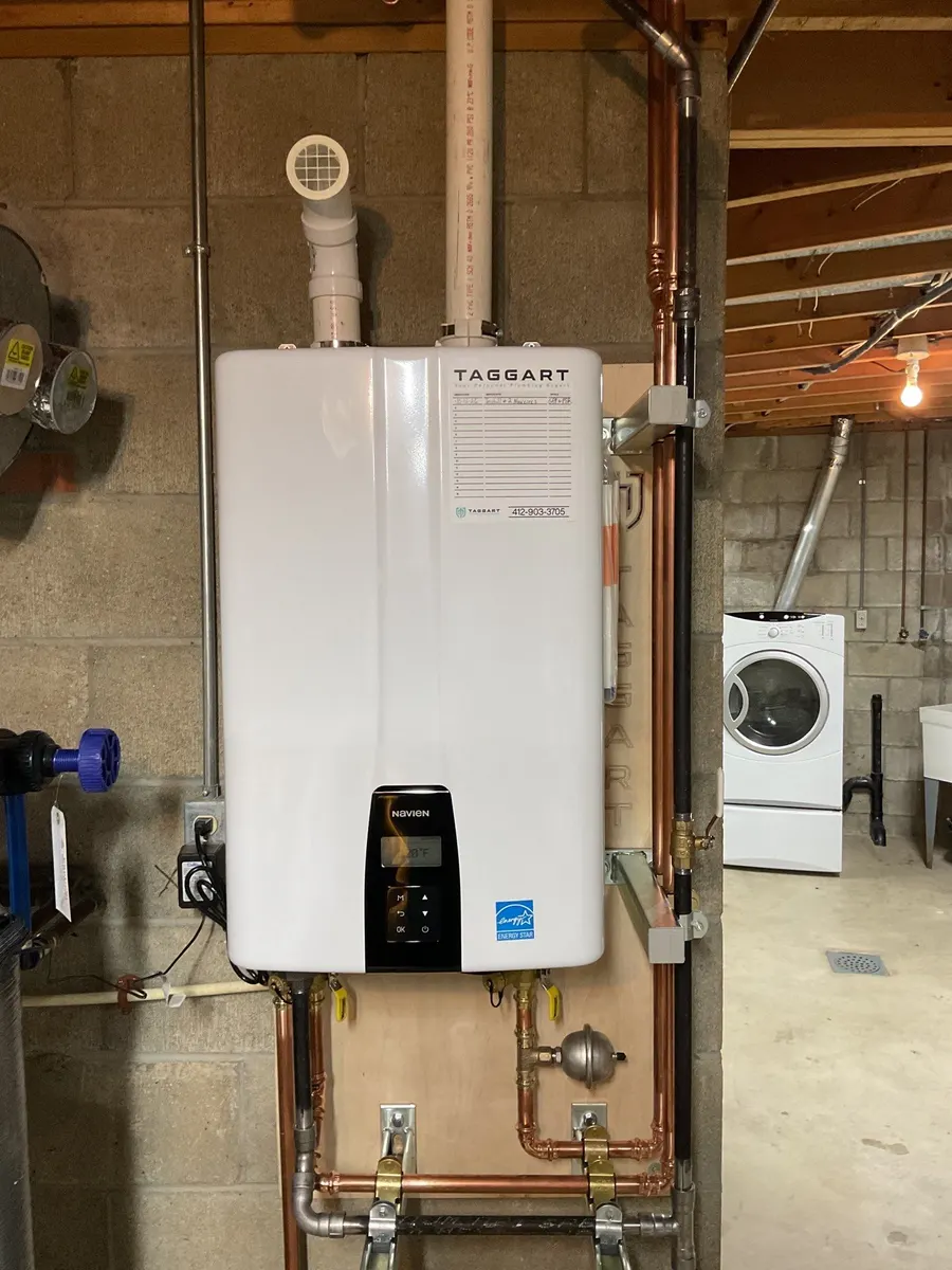 Wall-mounted tankless water heater with new copper piping in Pittsburgh, PA