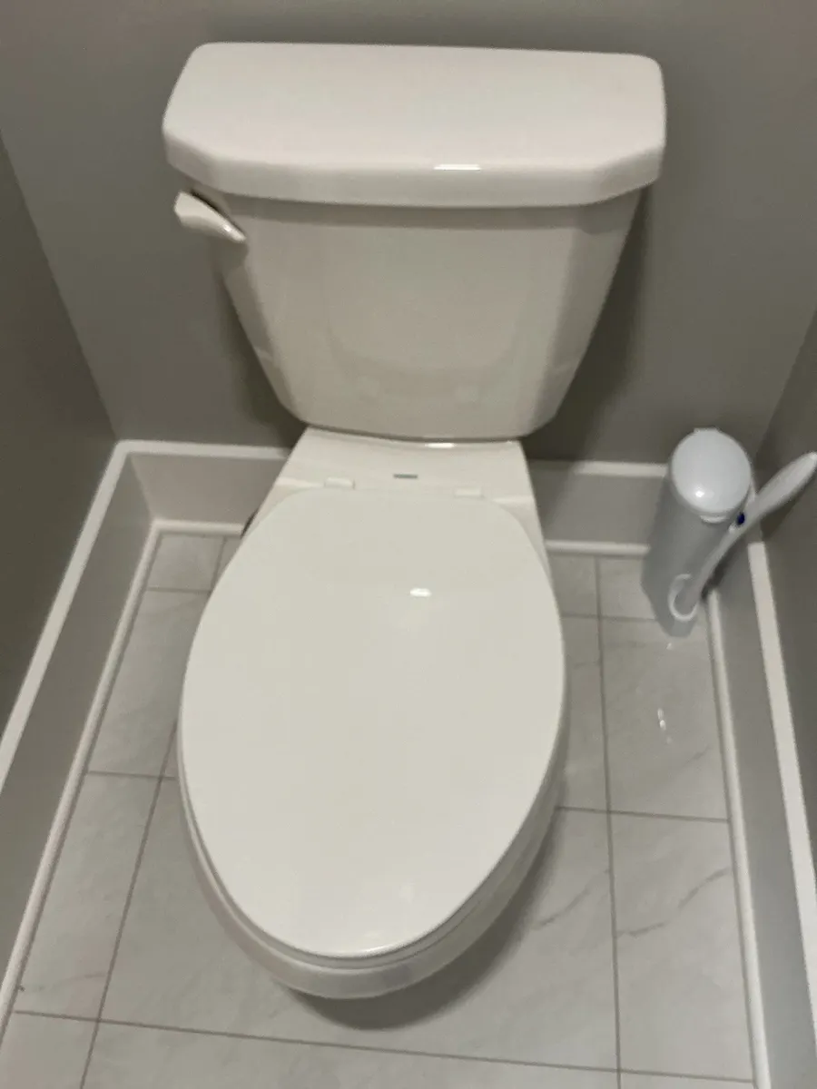 New white toilet installation in Pittsburgh, PA