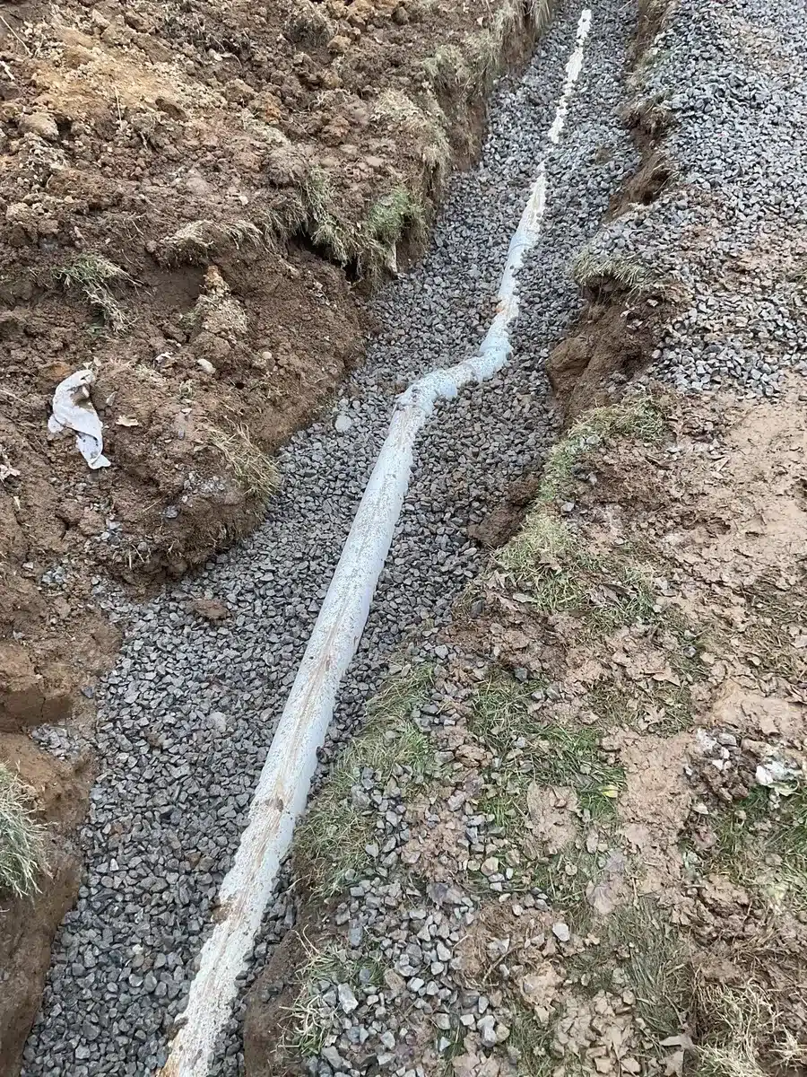 Underground water line repair trench in Pittsburgh, PA by Taggart Plumbing