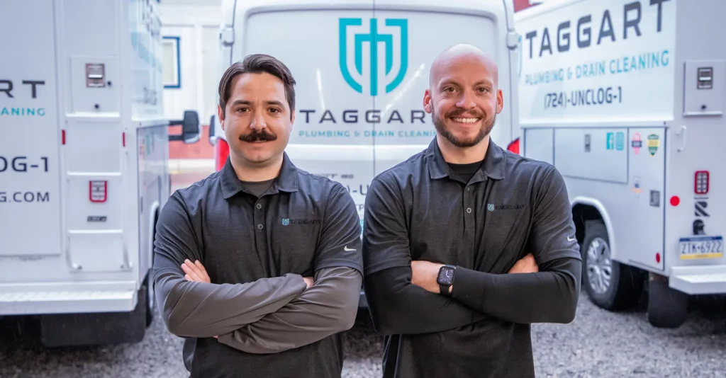 Taggart techs standing in front of fleet vans in Pittsburg, PA.