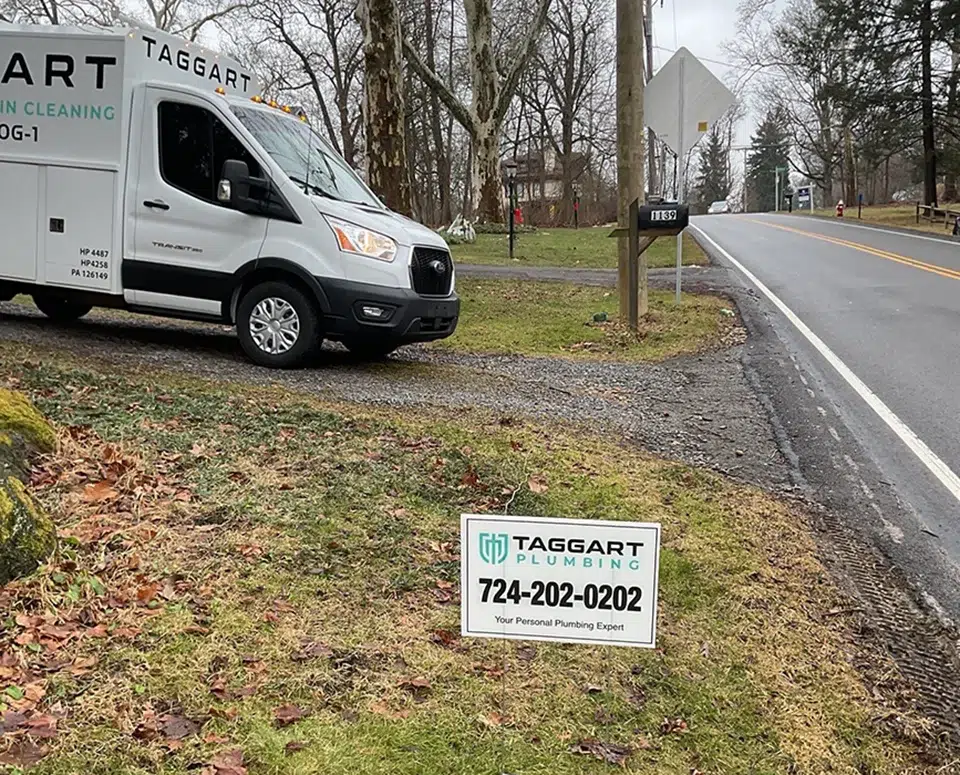 Taggart Plumbing work truck on service call in Pittsburgh, PA neighborhood