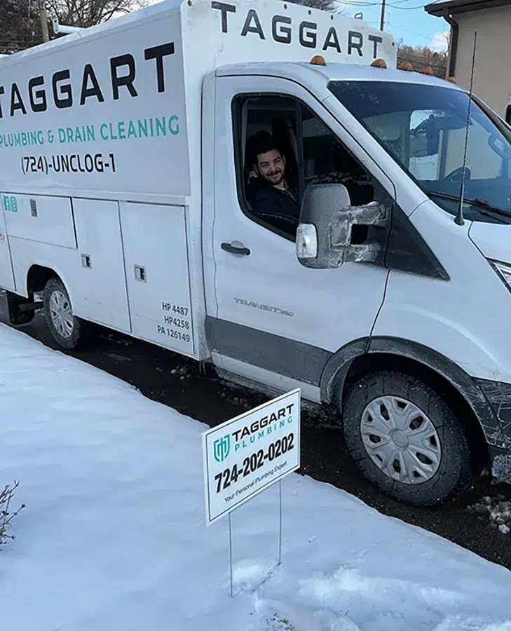 Taggart Plumbing service van at residential job site in Pittsburgh, PA