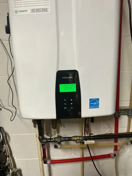 Navien tankless water heater wall-mounted and installed by the Taggart Plumbing crew in a Monaca, PA home