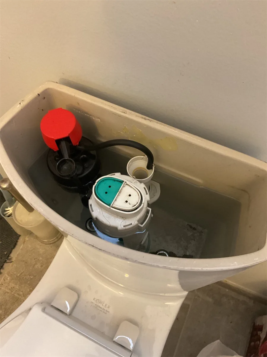 New fill valve and flapper fitted inside a toilet tank in Pittsburgh, PA