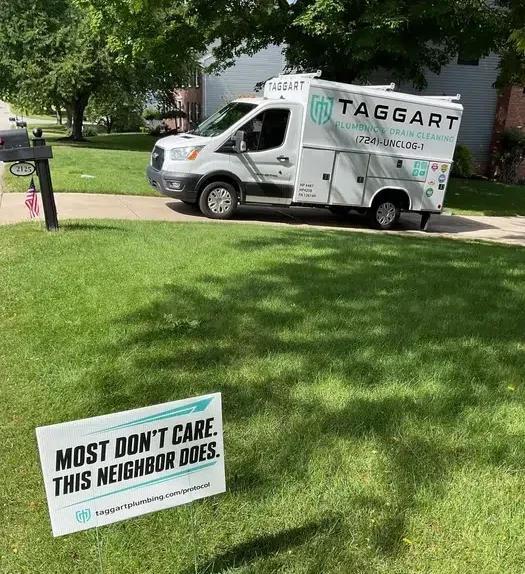 White Taggart Plumbing service van parked outside a home beside a branded yard sign in Allison Park, PA