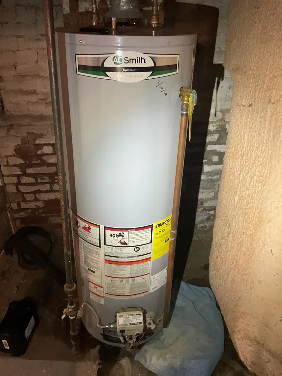 A.O. Smith water heater installed over a protective drop cloth in Pittsburgh, PA
